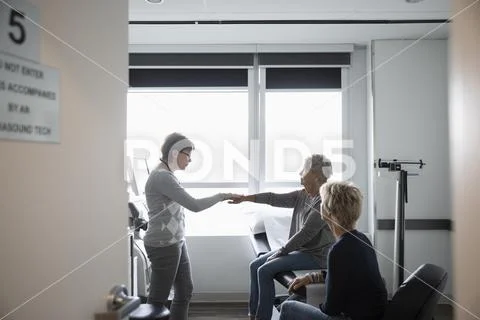 Image of a hand being examined by a doctor